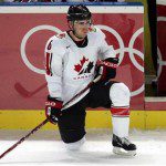 Canada’s Redden rests while the referee reviews a Canadian goal scoring opportunity against Switzerland in Turin