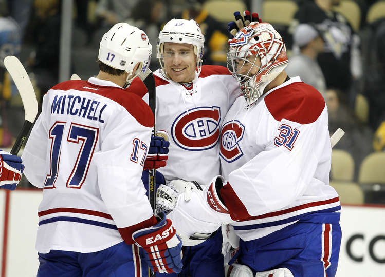 Torrey Mitchell, Tomas Fleischmann, Carey Price